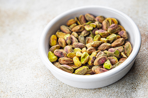 pistachios peeled without shell delicious nut delicious healthy eating cooking appetizer meal food snack on the table copy space food background rustic top view keto or paleo diet vegetarian vegan food
