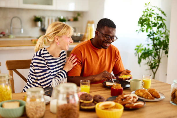 istock Multiracial couple enjoying breakfast together at home 1742837134