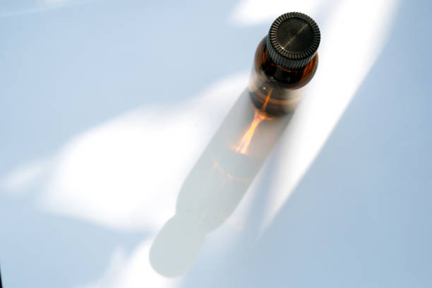 Top view amber glass bottle with shadow