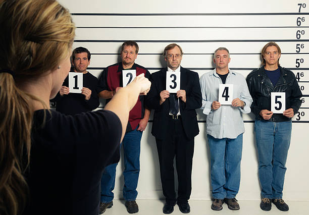 istock Person Pointing at a Police Lineup 174284144