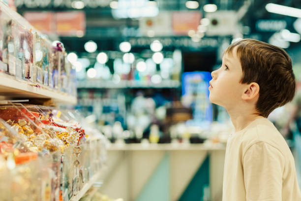 6 year old boy shopping in a supermarket