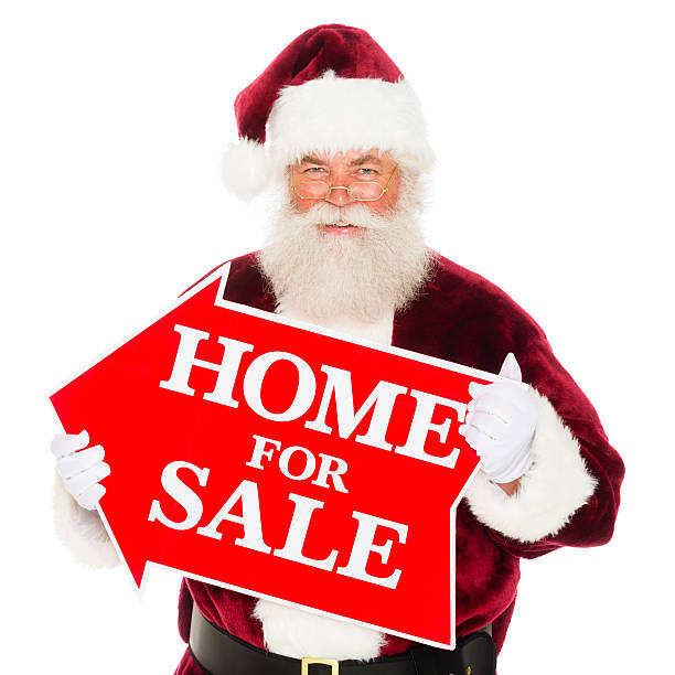 istock Santa Claus with a Real Estate Sign 174284813