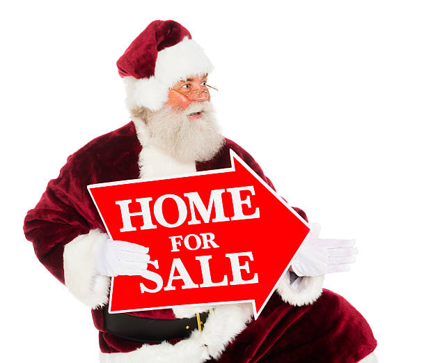 istock Santa Claus with a Real Estate Sign 174284815