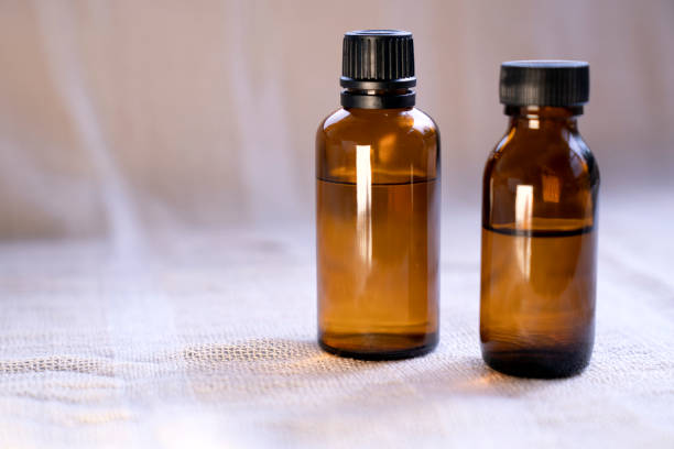 istock Mock-up Amber glass bottle with natural background 1742854229