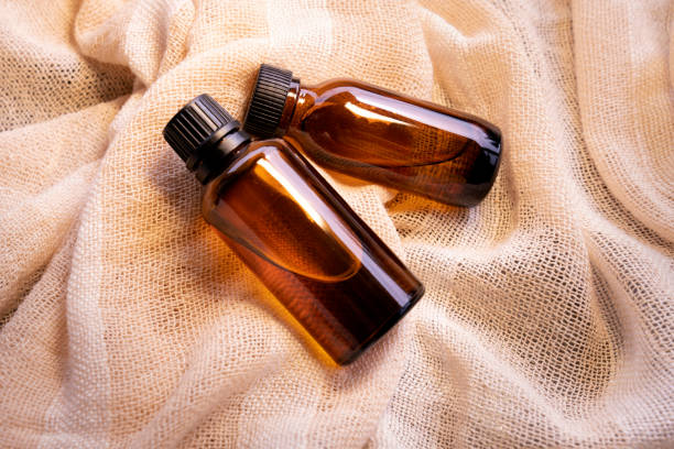 istock Mock-up Amber glass bottle with natural background 1742855383