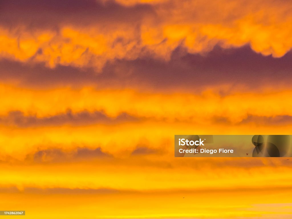 Idyllic Sunset Background Idyllic Sunset Background with dramatic clouds and sky Abstract Stock Photo