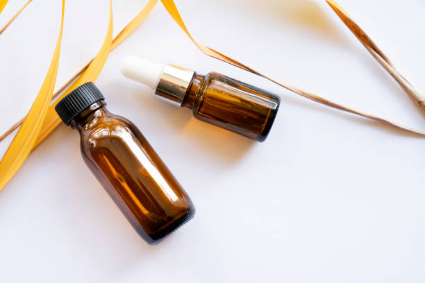 istock Mock-up Amber glass bottle with natural background 1742863689