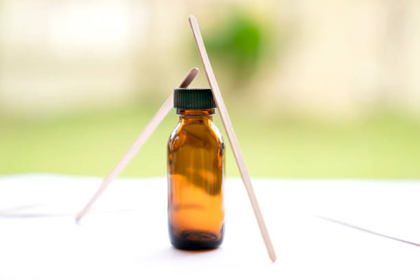 Mock-up Amber glass bottle with natural background