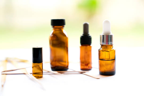 istock Mock-up Amber glass bottle with natural background 1742868490