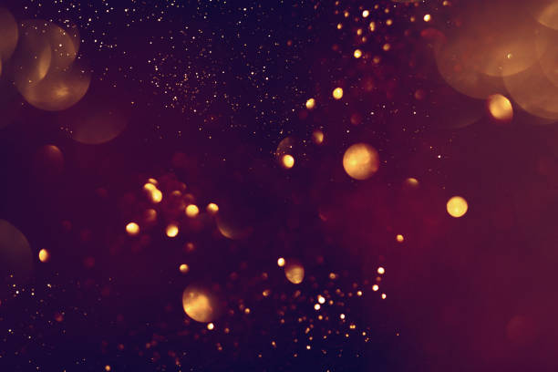 istock Golden abstract bokeh on black background. 1742882339