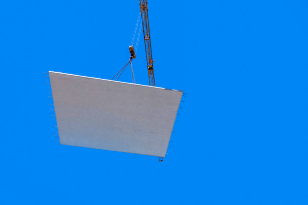 waterproof cocrete wall on a hook of a crane at the construction site in Germany