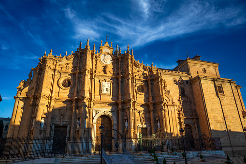 Wide view of the baroque facade of Guadix Cathedral, Granada, Andalusia, Spain, with beautiful morning light