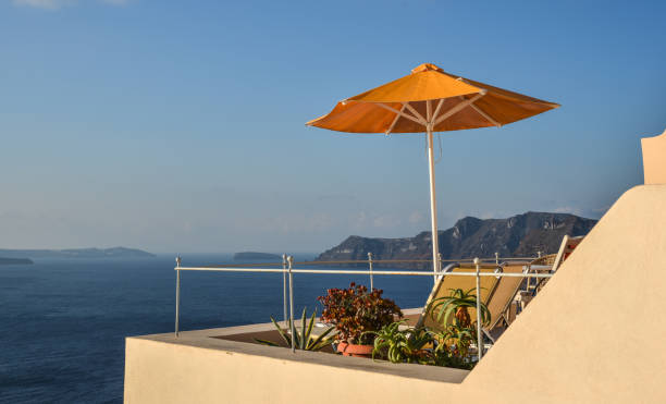 istock Relaxing chairs and beach umbrella 1742913462