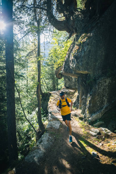 istock Trail runner bounds along mountain trail 1742918673