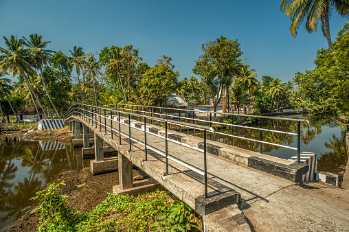 01 20 2013 Vintage Bridge over Canal on Waters, near Alleppey Alappuzha Kerala, India Asia.