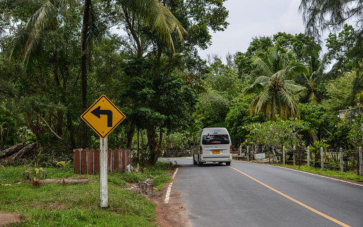 Phuket, Thailand - Apr 26, 2018. Rural road in Phuket, Thailand. Phuket lies off the west coast of Thailand in the Andaman Sea.