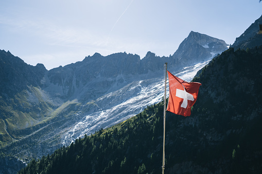 Swiss flag in the Swiss Alps.