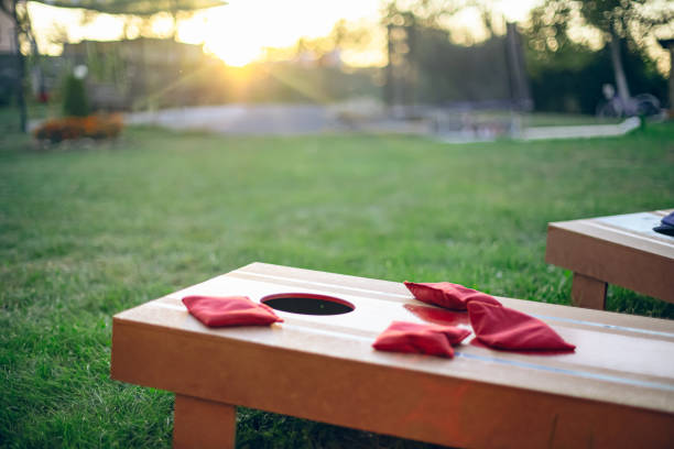 Homemade corn hole board game in backyard