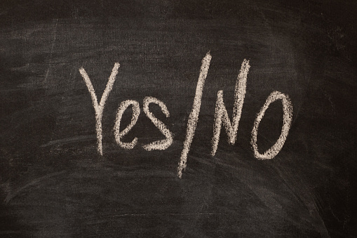 The words yes and no across the line as a concept of choice in the side of yes.