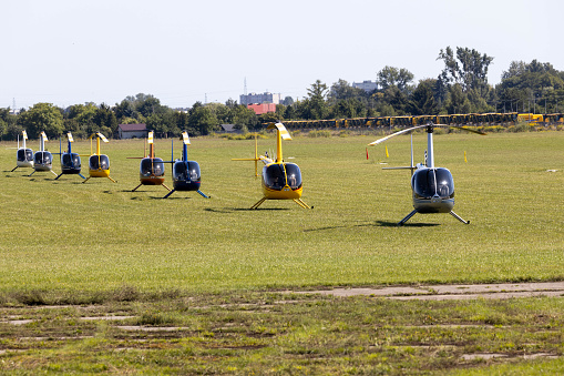 Helicopters on grass airfield