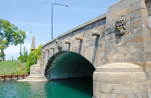 Jackson Park Animal Bridge, Chicago, Illinois, USA festooned with grogoyles or grotesques in the forms of heads of hippopotamus, rhinoceros, a green man and a masthead with screaming warrior.