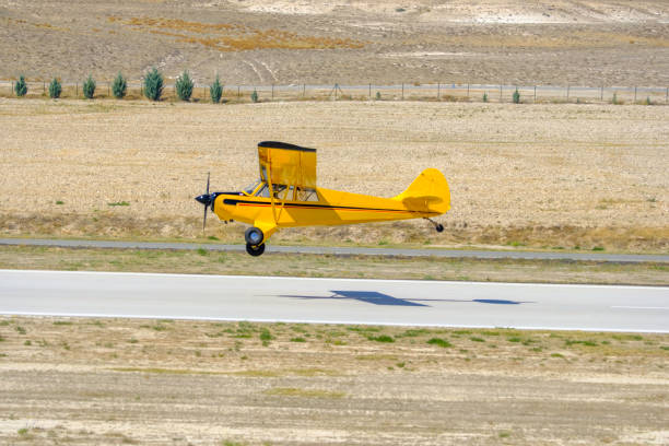 istock Classic old retro vintage airplane with a propeller landing 1742986272