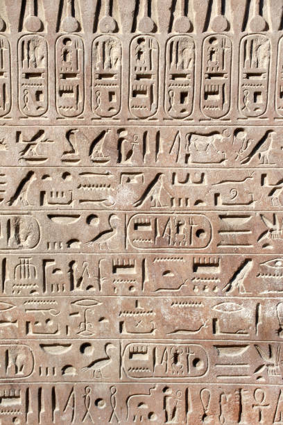 istock Ancient Egyptian hieroglyphs on stone wall, Karnak Temple Complex, Luxor, Egypt, Africa 1742988997