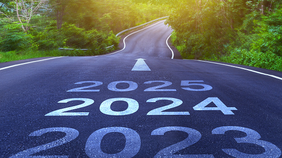 Empty asphalt road with New year 2024 concept. Direction to new year concept and sustainable development idea for goal and success, concept for vision 2023-2025.