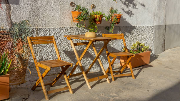 istock Sunlit Garden: Empty Chair in a Blooming Outdoor Oasis 1742996082
