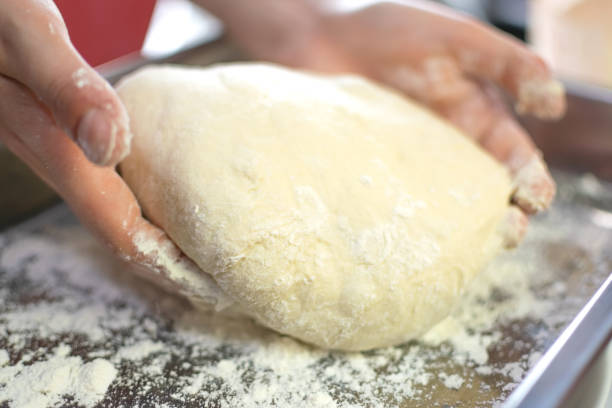 istock Levitated and Puffed Bread Dough with circular shape and sprinkled flour 1743002667