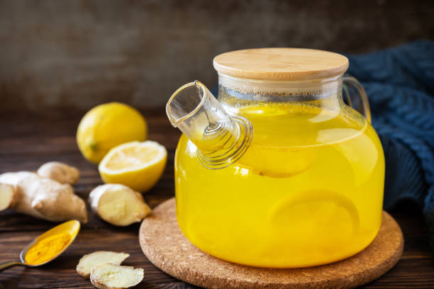 istock Healthy turmeric hot drink tea with lemon, ginger and honey on rustic table. Alternative medicine concept, immune system booster in winter. Copy space. 1743033287
