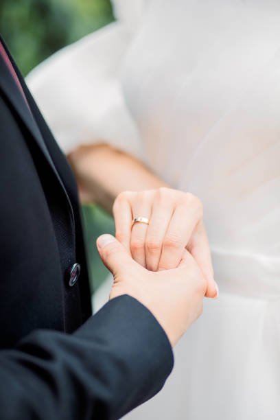 istock Hands of bride and groom with wedding rings 1743069454