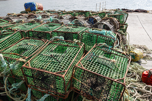 Crab traps stacked on a Harbor. Pile of lobster pots