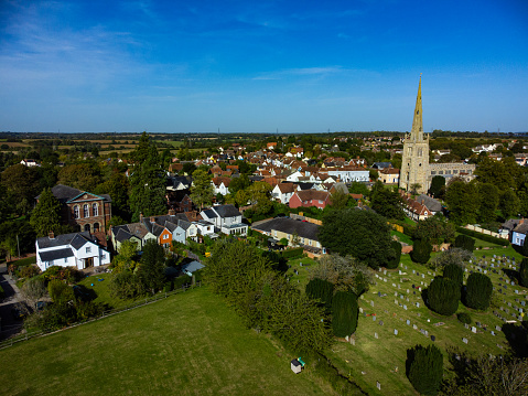 Aerial view of Thaxted church and surroundings in Essex, UK. Blue sky, end of summer/ start of autumn.
