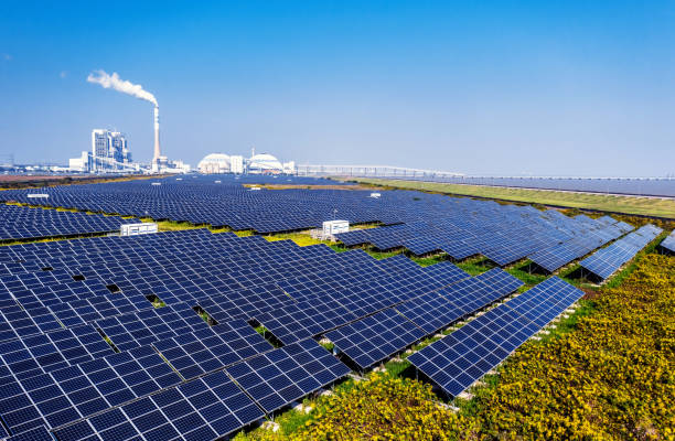 istock Thermal power plant and solar panels on the beach 1743078941