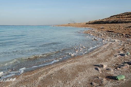 In this image you can see the landscape depicting the expanse of the Dead Sea with Israel on the horizon