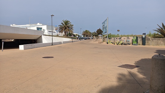 12.04.2023 Built pedestrian infrastructure along the oceanfront in Carcavelos, palm trees, electric scooters, sidewalks photo