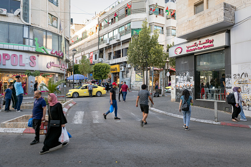Ramallah, Palestine - June 5, 2023: Pedestrians walk in the West Bank city of Ramallah.