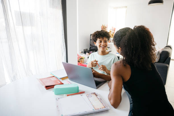istock Girl doing her homework with mother 1743100794