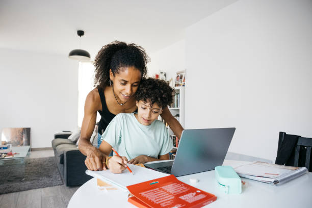 istock Girl doing her homework with mother 1743101029