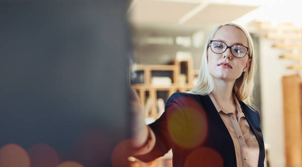 istock Writing, planning and business woman in office for brainstorming, problem solving and ideas. Corporate company, mockup and worker write on board for presentation, solution and project management 1743115932