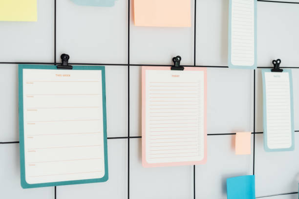 istock Close up grid mood inspiration board with mockup empty notes, Check lists and stickers on clamps for ideas, organizations, memories, wish lists with copy space. Plan for day and week. Selective focus 1743121533