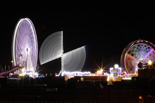 Big Illuminated Wheel In Fair Night Time