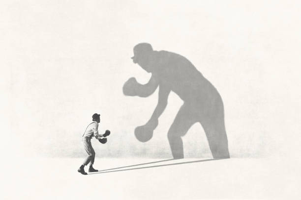 istock Illustration of man fighting with his shadow, facing fears surreal concept 1743124774