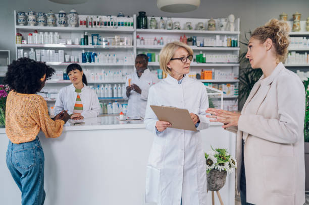 istock Senior pharmacist talking with a customer in a pharmacy 1743129152