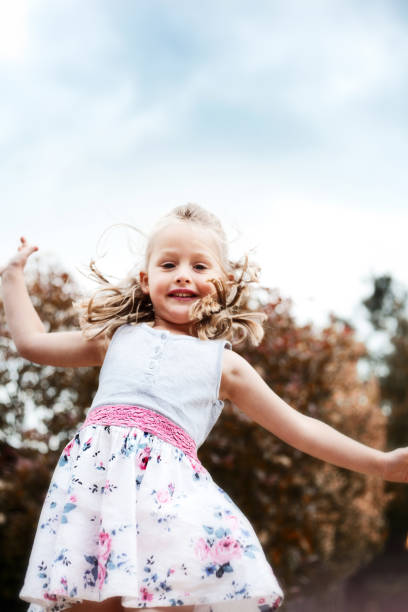 istock Little Girl Jumping 174313267