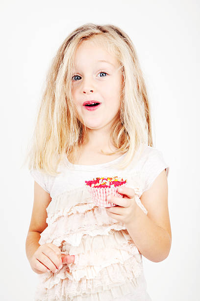 istock 4 Year Old Girl with Cupcake 174313382