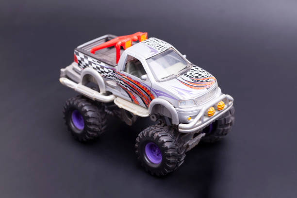 istock SUV toy car on black background. 1743134009