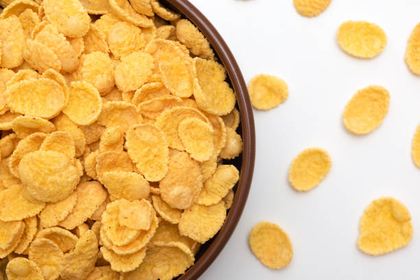 istock Corn flakes in a plate close-up on a white background, top view 1743138437