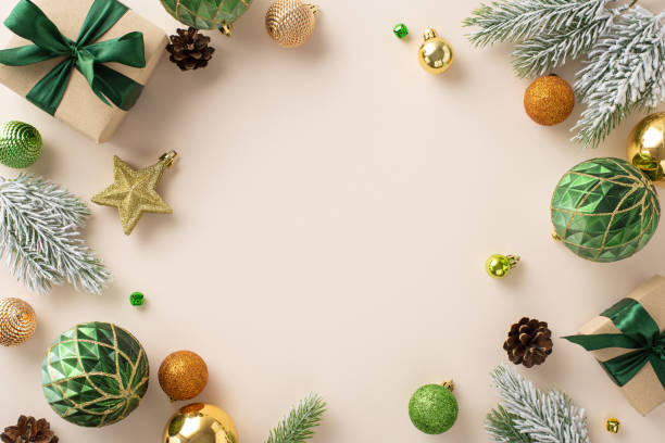 istock Holiday Delight: Top-view perspective of rustic gift parcels, gleaming golden, green, and orange tree baubles, star ornament, frosted fir branches on pastel beige, frame for your festive message 1743171962